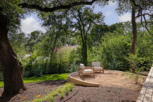 a view of a house with backyard porch and sitting area
