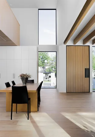 a dining room with furniture and a window
