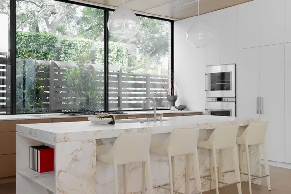 a dining table with a sink and mirror
