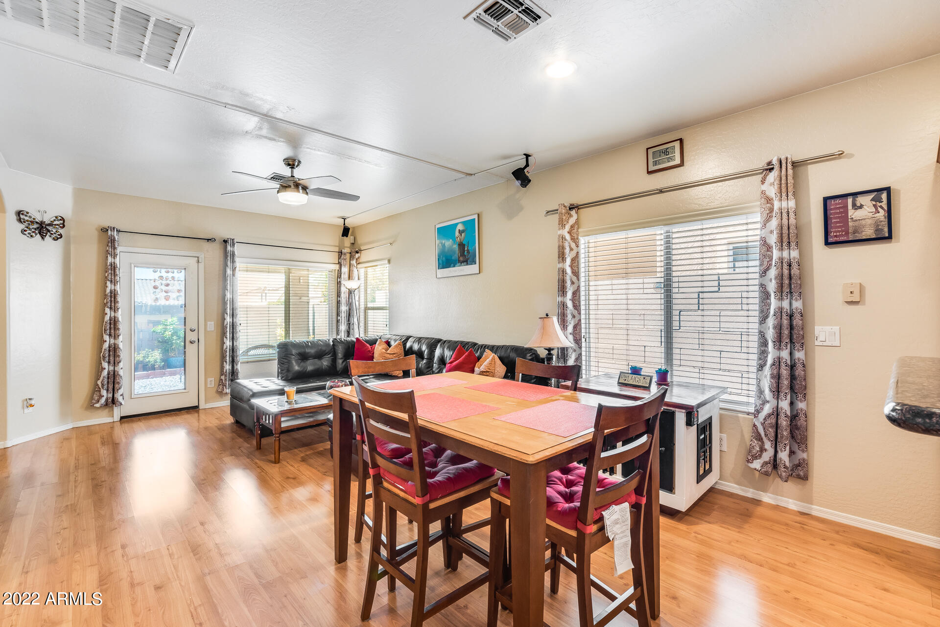 1868 South Rome Street Gilbert, AZ 85295 - Photo 13 of 34 a view of a dining room with furniture and wooden floor