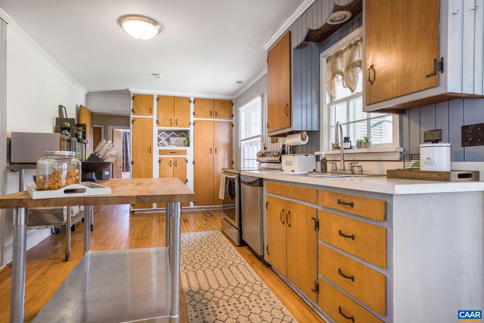 5374 Gordonsville Road Keswick, VA 22947 - Photo 12 of 35 a large kitchen with stainless steel appliances granite countertop a sink and cabinets