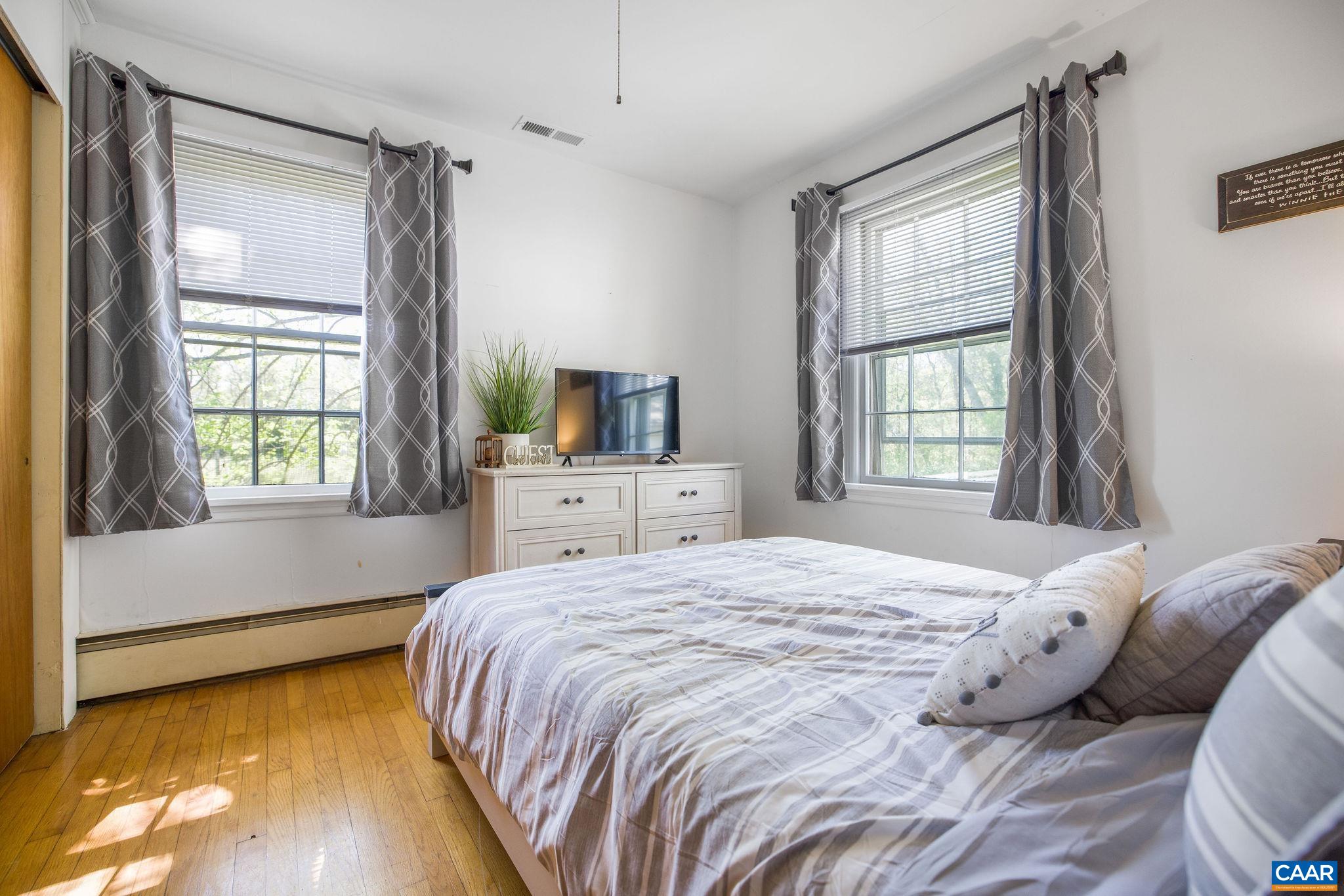 5374 Gordonsville Road Keswick, VA 22947 - Photo 17 of 35 a bedroom with a bed and a window