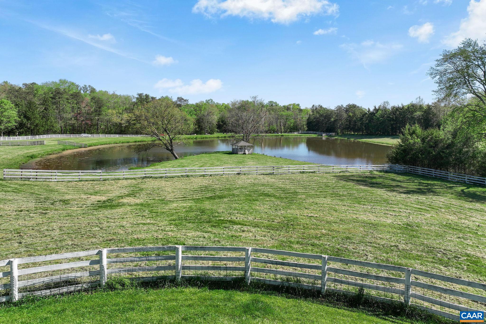 5374 Gordonsville Road Keswick, VA 22947 - Photo 24 of 35 a view of a lake from a yard