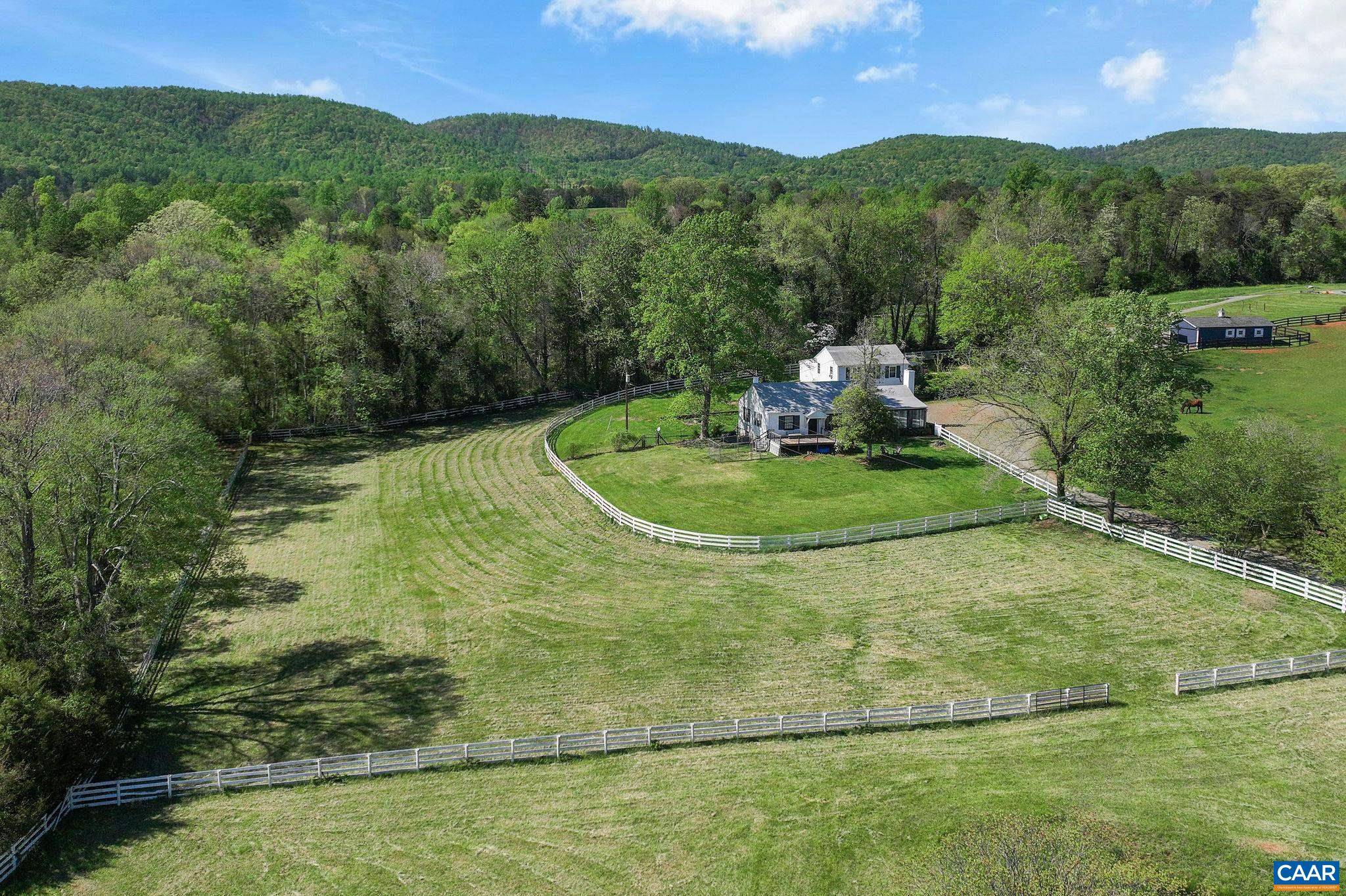 5374 Gordonsville Road Keswick, VA 22947 - Photo 26 of 35 a view of a golf course with a yard