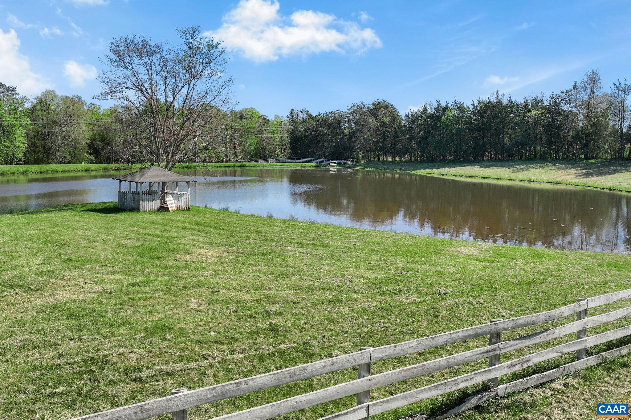 5374 Gordonsville Road Keswick, VA 22947 - Photo 27 of 35 a view of a lake from a yard