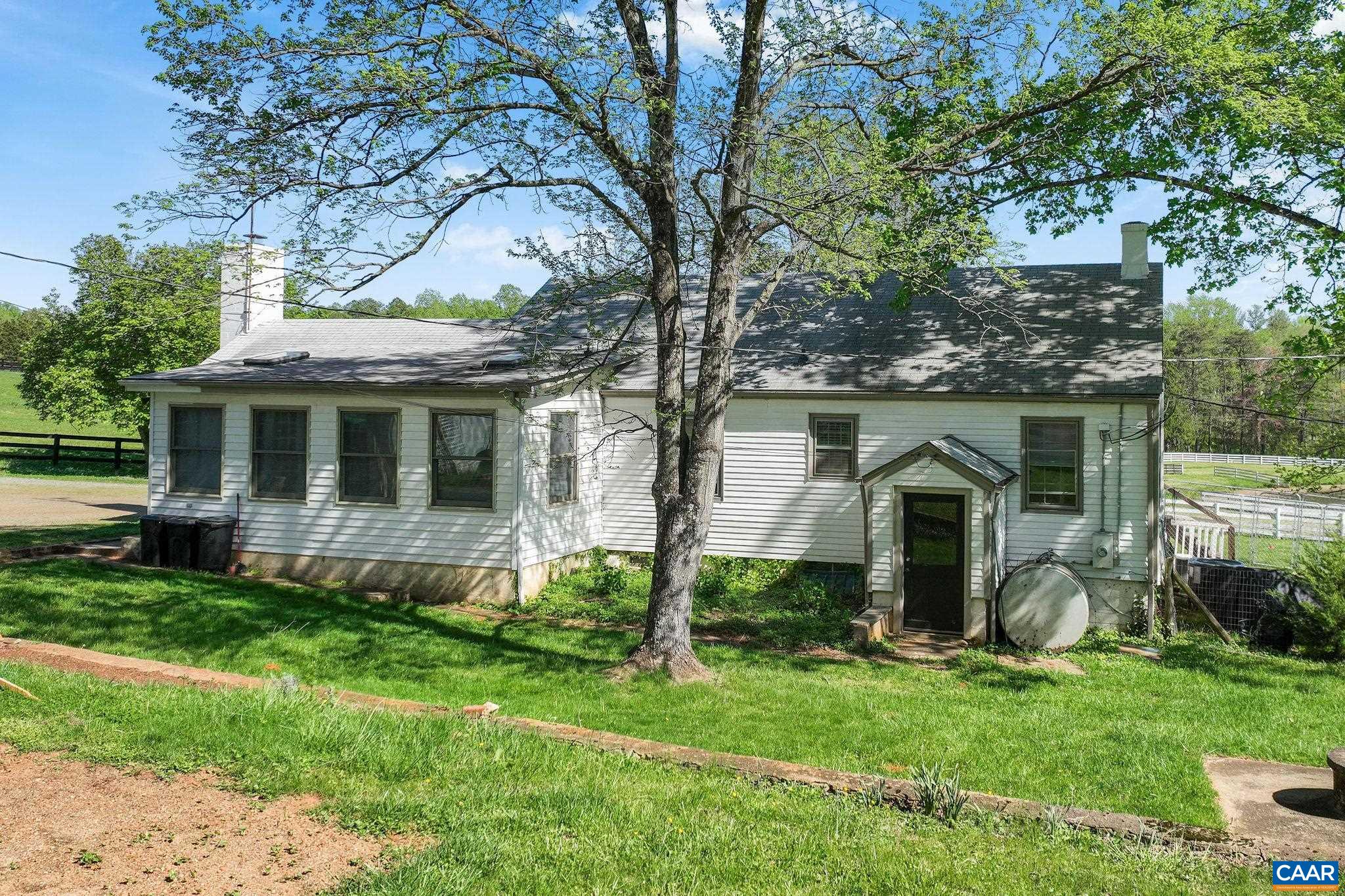5374 Gordonsville Road Keswick, VA 22947 - Photo 5 of 35 a front view of a house with a garden