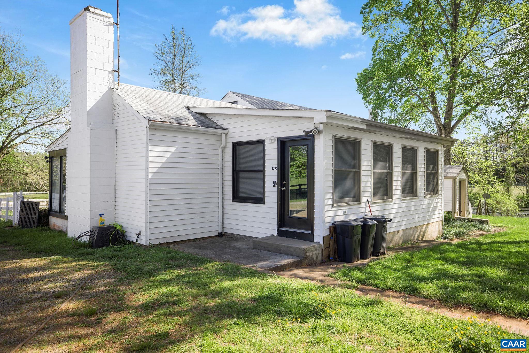 5374 Gordonsville Road Keswick, VA 22947 - Photo 6 of 35 a view of a house with backyard and porch