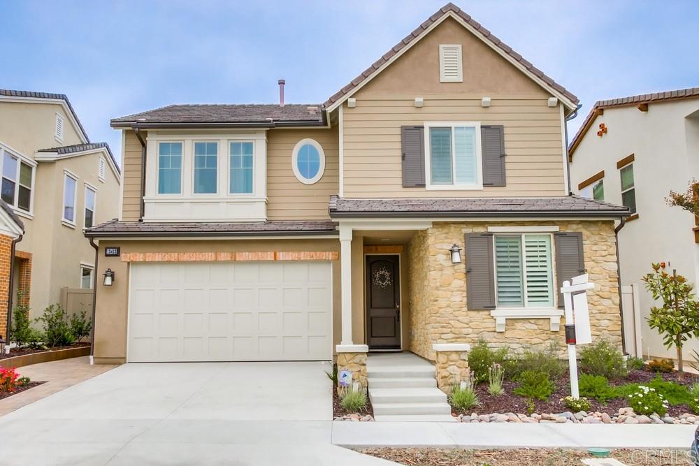 a front view of a house with a garage