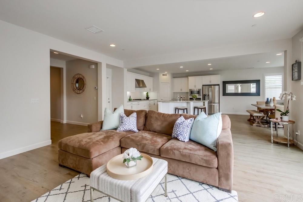 13413 Red Oak Way San Diego, CA 92130 - Photo 2 of 25 a living room with furniture and kitchen view