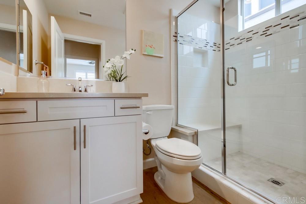 13413 Red Oak Way San Diego, CA 92130 - Photo 11 of 25 a bathroom with a sink toilet and shower