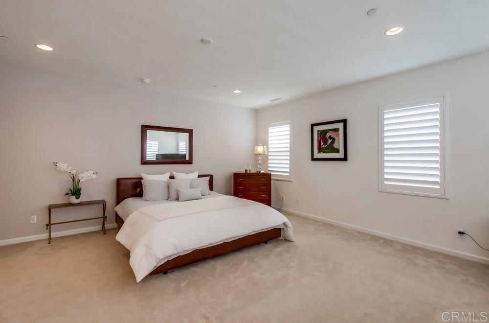13413 Red Oak Way San Diego, CA 92130 - Photo 13 of 25 a bedroom with a bed and a couch