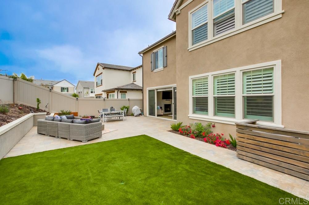 13413 Red Oak Way San Diego, CA 92130 - Photo 24 of 25 a front view of a house with a yard and sitting area