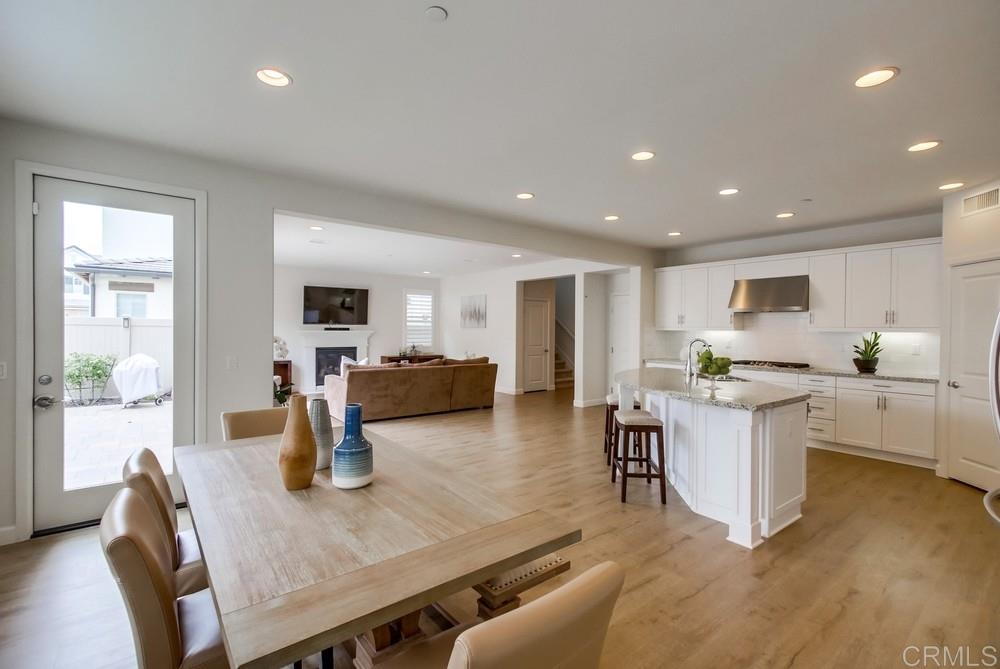 13413 Red Oak Way San Diego, CA 92130 - Photo 6 of 25 a view of kitchen with dining table and chairs