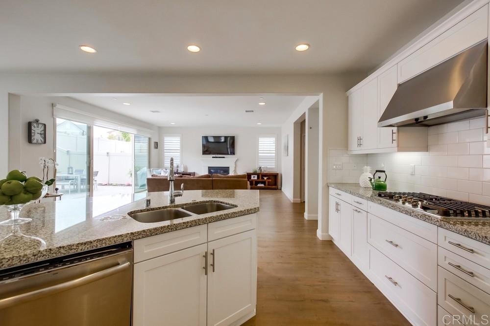 13413 Red Oak Way San Diego, CA 92130 - Photo 7 of 25 a kitchen with counter top space cabinets and appliances