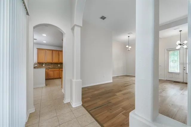 a view of hallway with wooden floor