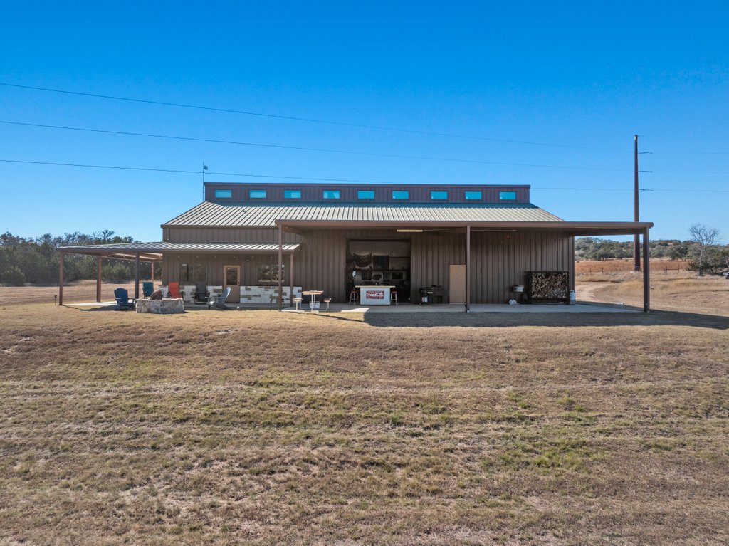 3259 Schumann Road Stonewall, TX 78671 - Photo 4 of 35 a view of a house with a yard