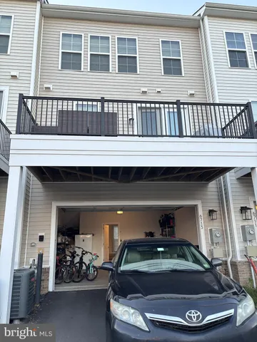 a car parked in front of a house