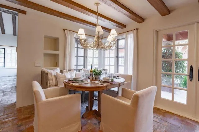 a bedroom with a bed and a view of balcony
