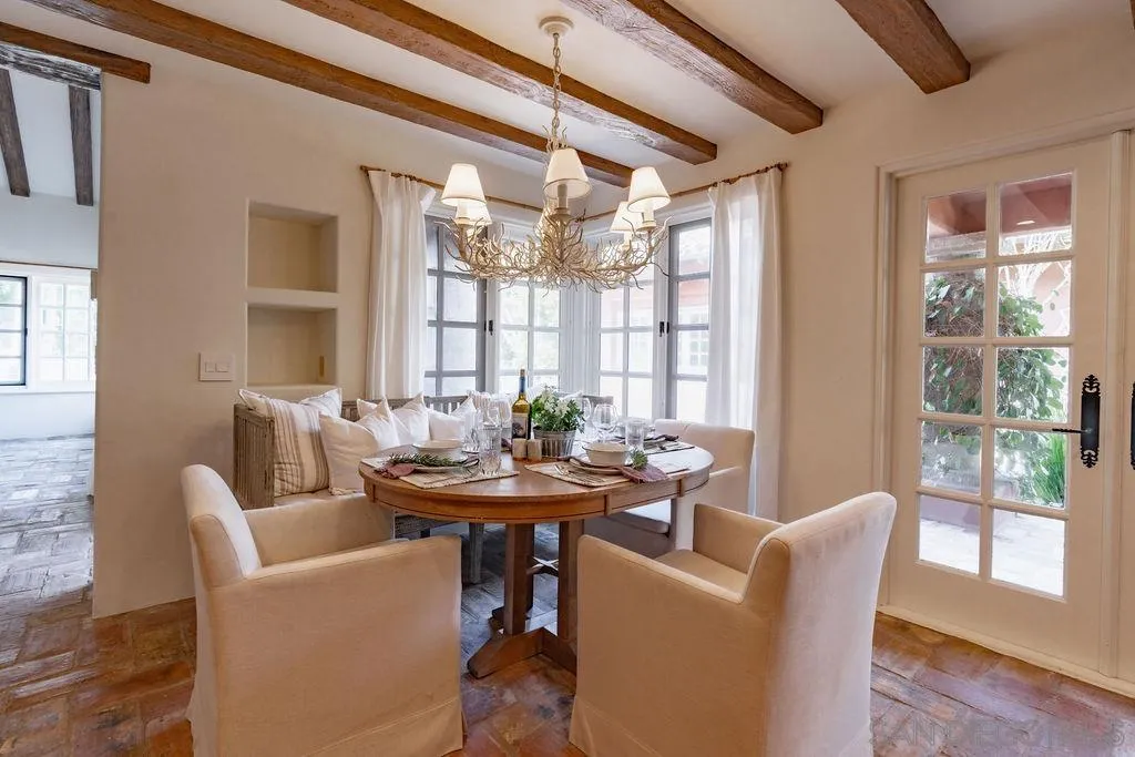 17116 Paseo Hermosa, Unit A Rancho Santa Fe, CA 92067 - Photo 14 of 47 a view of a dining room with furniture wooden floor and a chandelier