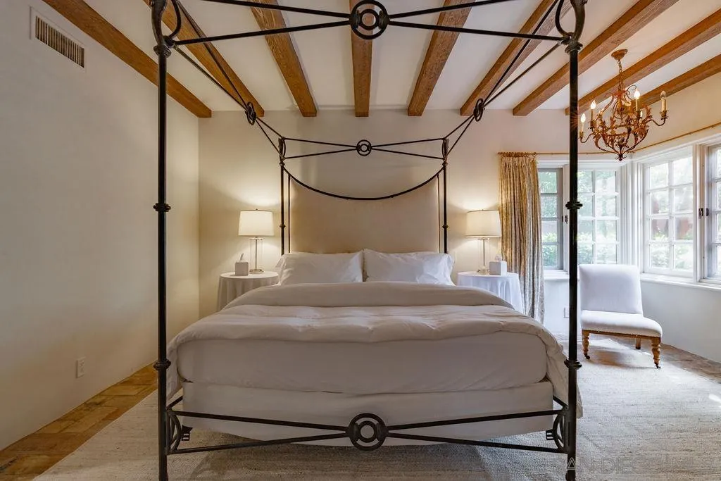 17116 Paseo Hermosa, Unit A Rancho Santa Fe, CA 92067 - Photo 15 of 47 a bedroom with a bed and a view of balcony