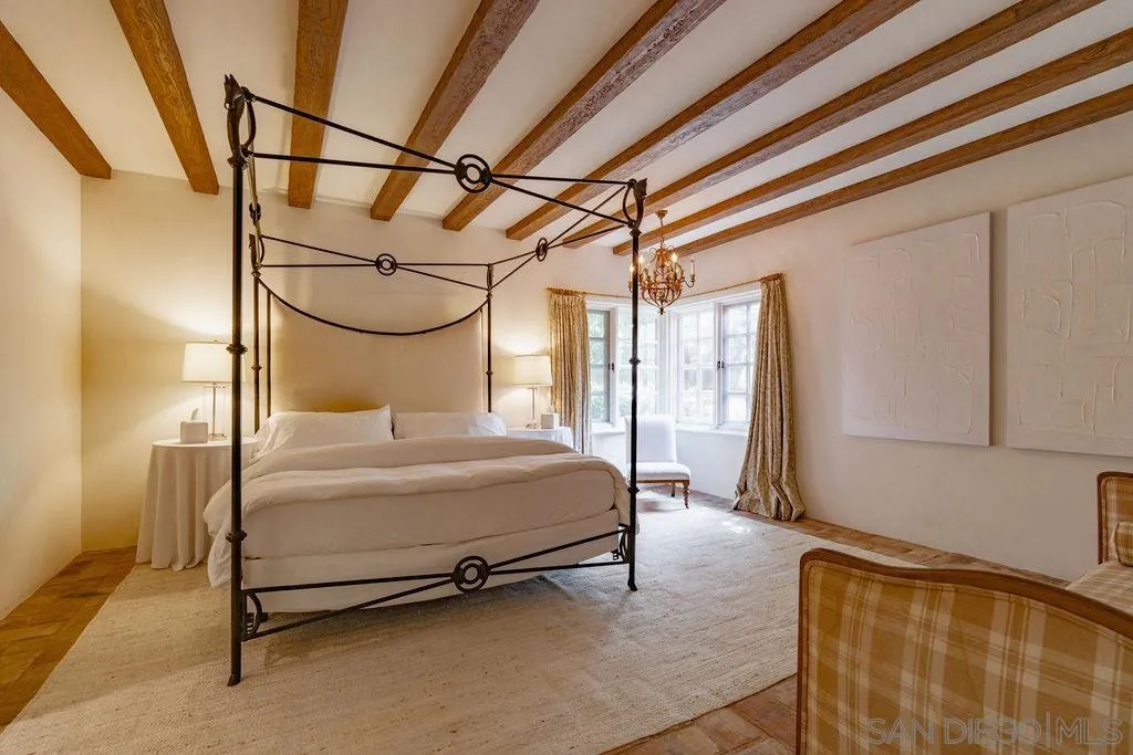 17116 Paseo Hermosa, Unit A Rancho Santa Fe, CA 92067 - Photo 17 of 47 a bedroom with a bed and a mirror