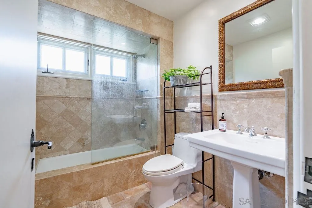 17116 Paseo Hermosa, Unit A Rancho Santa Fe, CA 92067 - Photo 22 of 47 a bathroom with a sink toilet and shower