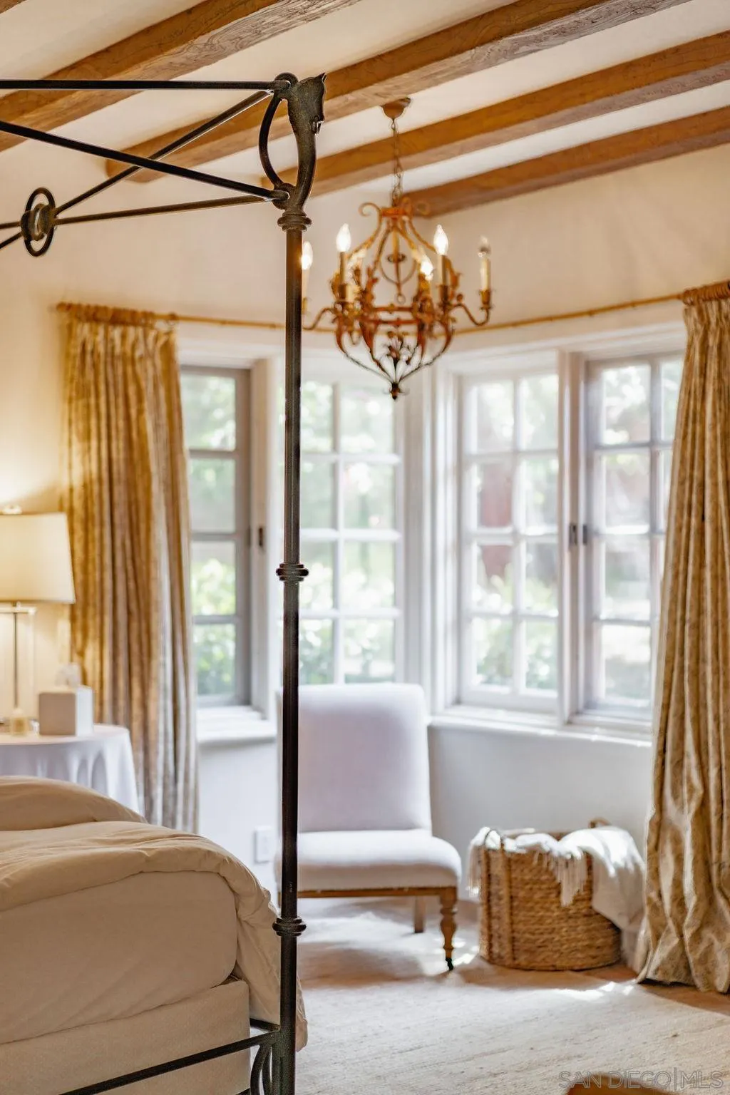 17116 Paseo Hermosa, Unit A Rancho Santa Fe, CA 92067 - Photo 23 of 47 a bedroom with a bed and a window