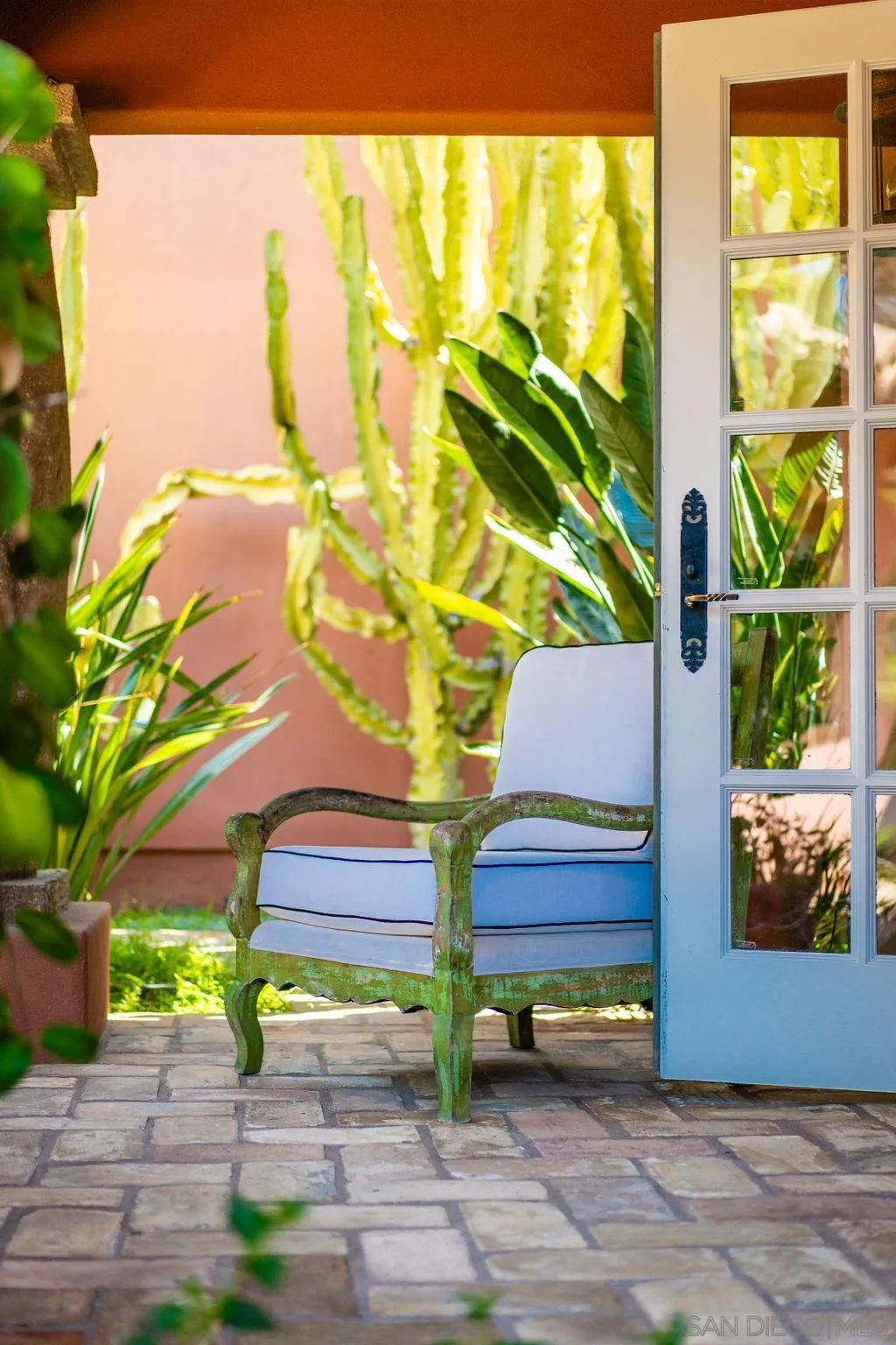 17116 Paseo Hermosa, Unit A Rancho Santa Fe, CA 92067 - Photo 31 of 47 a bench sitting in front of a building