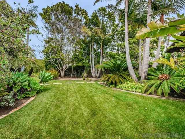 an aerial view of a house with outdoor space tennis court