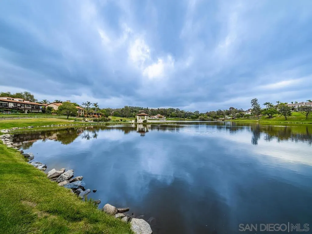 17116 Paseo Hermosa, Unit A Rancho Santa Fe, CA 92067 - Photo 45 of 47 a view of a lake with houses in the background