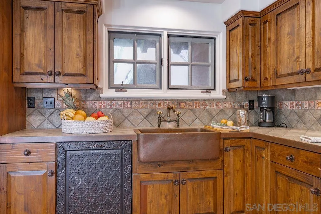 17116 Paseo Hermosa, Unit A Rancho Santa Fe, CA 92067 - Photo 10 of 47 a kitchen with stainless steel appliances granite countertop a sink stove and cabinets