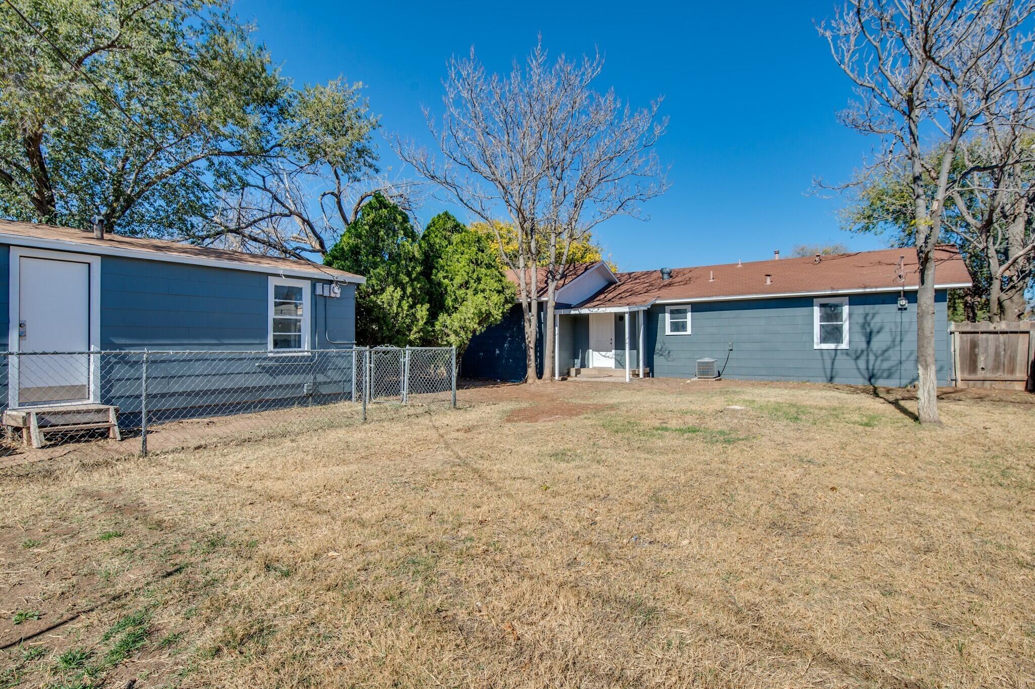 a house with trees in front of it