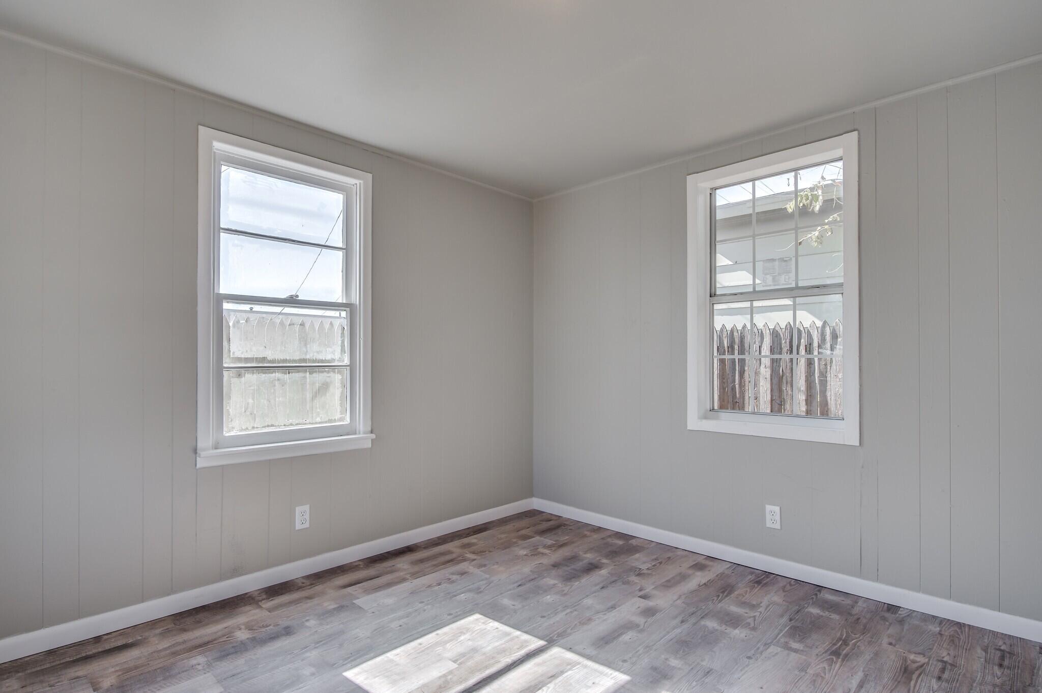 4813 40th Street, Unit REAR Lubbock, TX 79414 - Photo 6 of 7 a view of an empty room and window