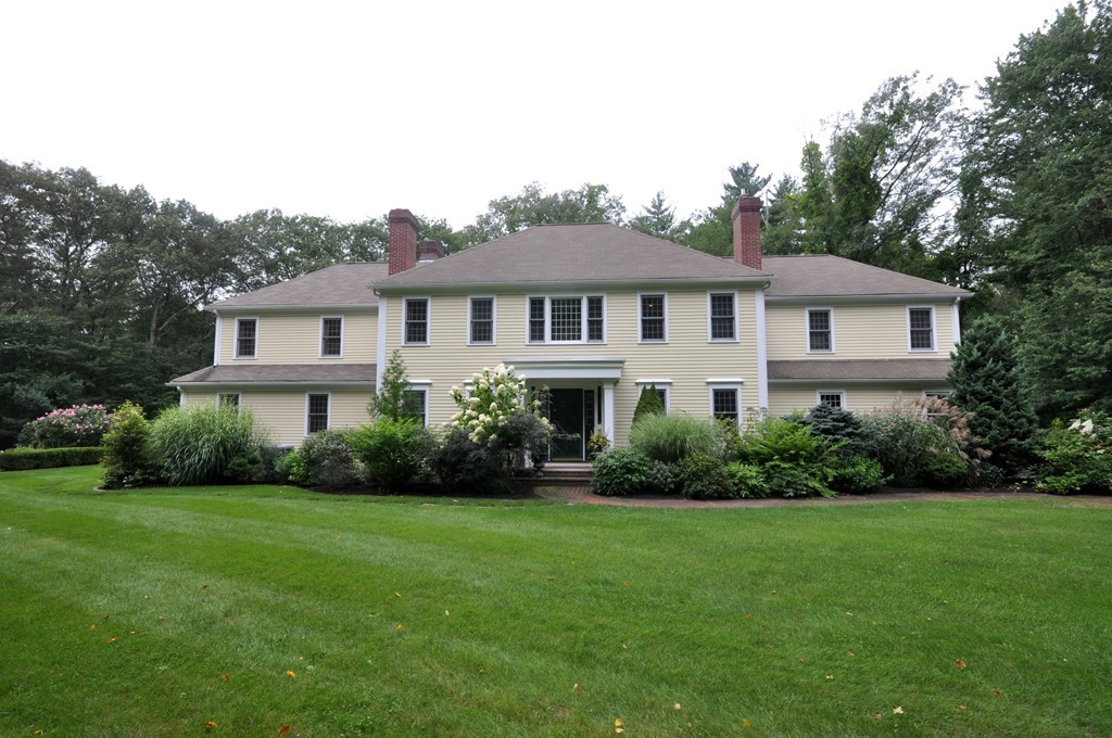 180 Pope Road Acton, MA 01720 - Photo 1 of 24 a front view of a house with a yard and trees