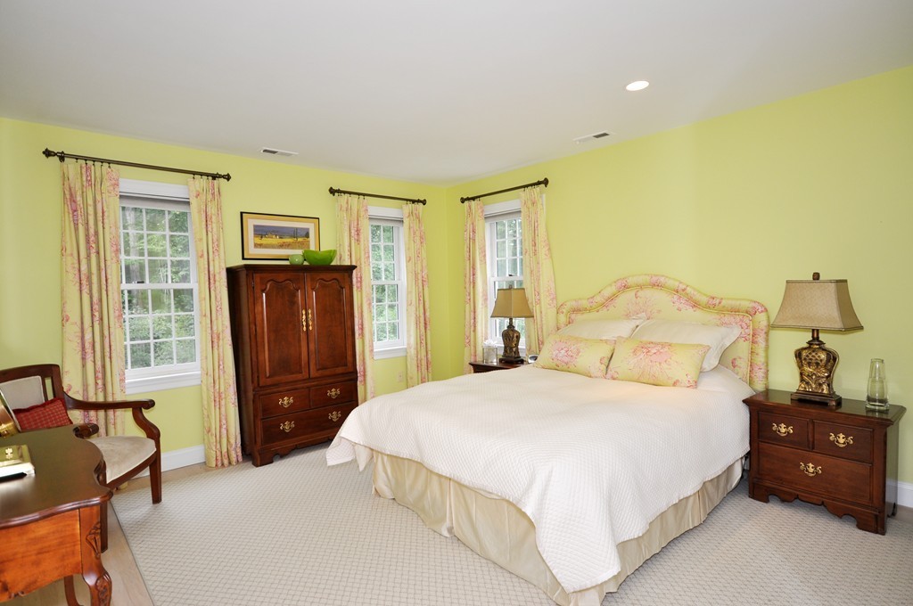 180 Pope Road Acton, MA 01720 - Photo 15 of 24 a bedroom with a bed and wooden floor