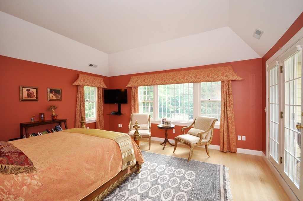 180 Pope Road Acton, MA 01720 - Photo 18 of 24 a bed room with a bed and a chair