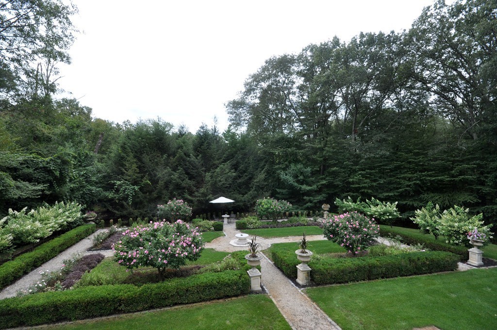 180 Pope Road Acton, MA 01720 - Photo 21 of 24 a view of a garden with large trees