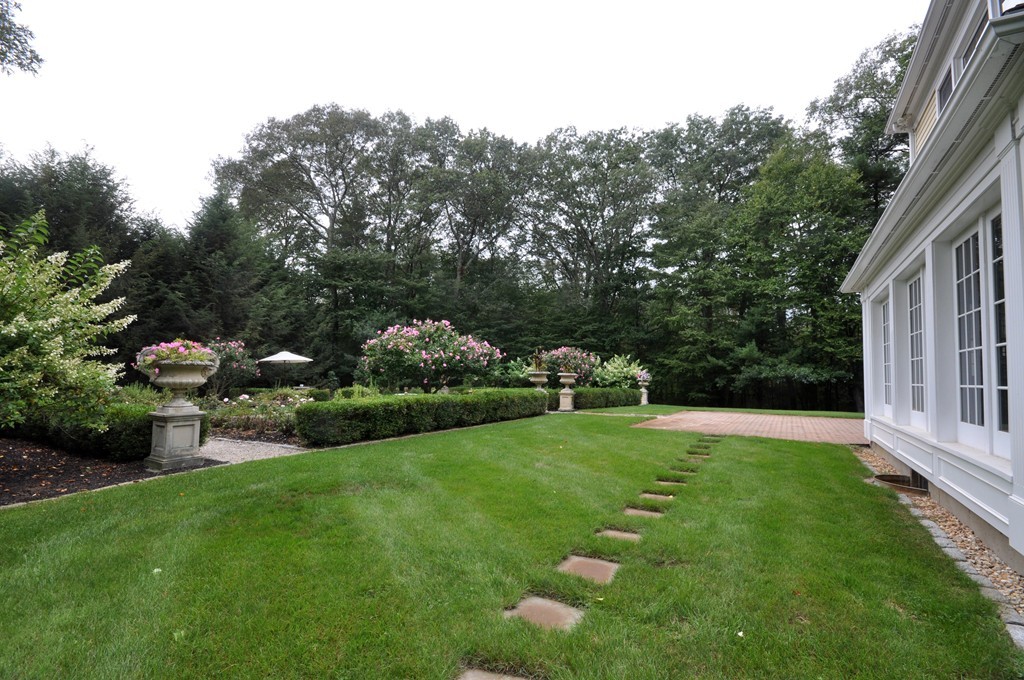 180 Pope Road Acton, MA 01720 - Photo 3 of 24 a backyard of a house with lots of green space