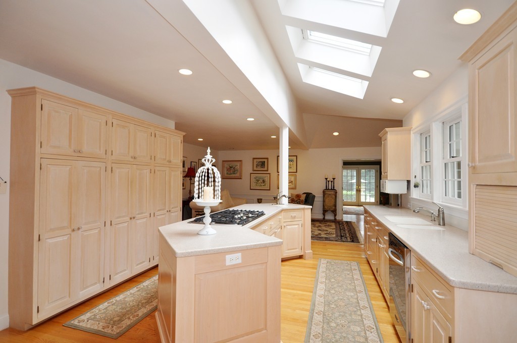 180 Pope Road Acton, MA 01720 - Photo 6 of 24 a kitchen with stainless steel appliances kitchen island granite countertop a sink and cabinets