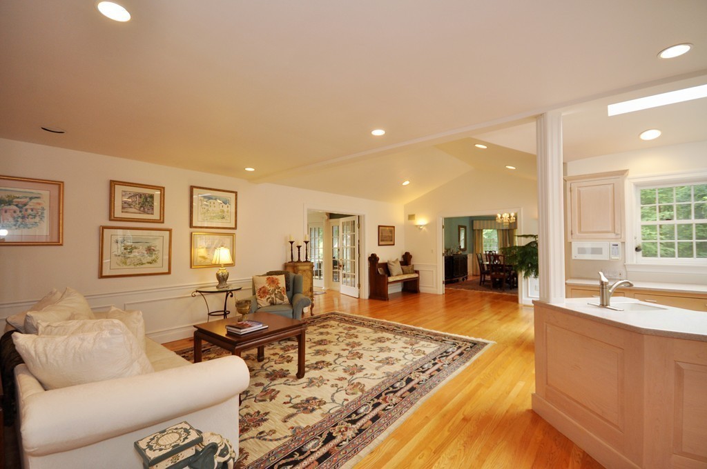 180 Pope Road Acton, MA 01720 - Photo 8 of 24 a living room with furniture and a table with wooden floor