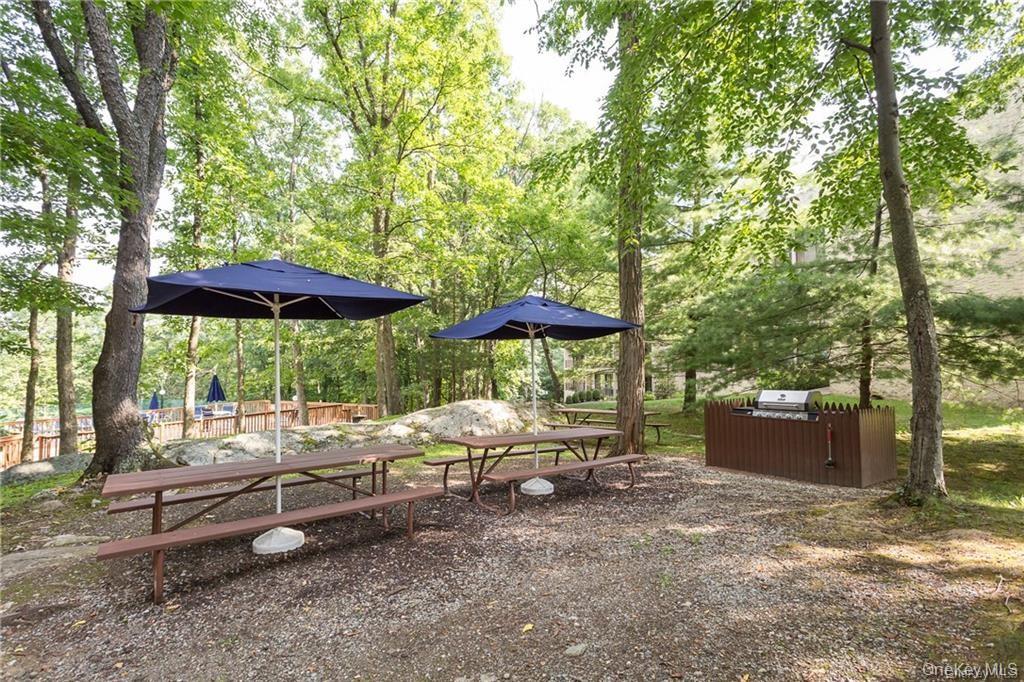 150 Overlook Avenue, Unit 2K Peekskill, NY 10566 - Photo 15 of 26 a view of backyard with outdoor seating and trees