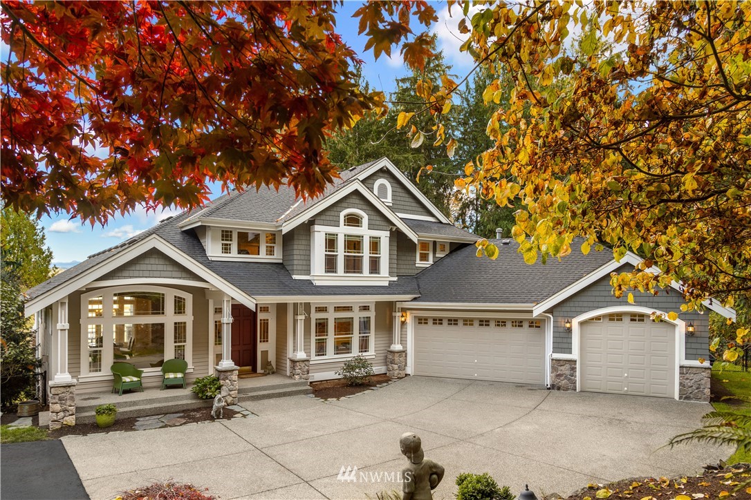 8707 West Snoqualmie Valley Road Northeast Carnation, WA 98014 - Photo 1 of 39 a front view of a house with a yard