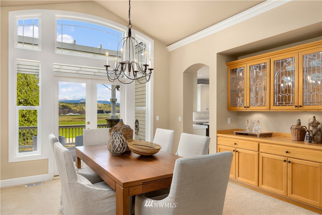 8707 West Snoqualmie Valley Road Northeast Carnation, WA 98014 - Photo 11 of 39 a dining room with furniture and window