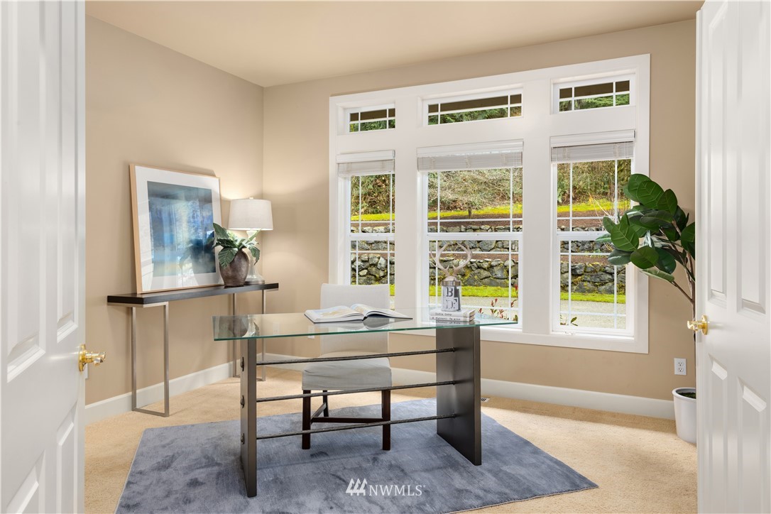8707 West Snoqualmie Valley Road Northeast Carnation, WA 98014 - Photo 12 of 39 a dining room with furniture and window