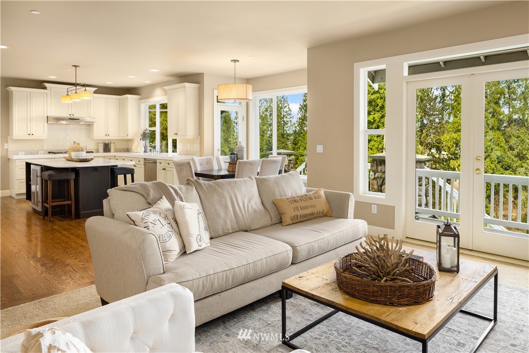 8707 West Snoqualmie Valley Road Northeast Carnation, WA 98014 - Photo 15 of 39 a living room with furniture and a large window