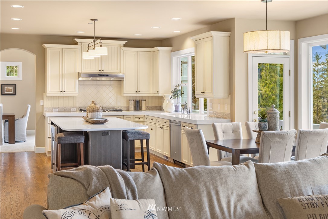 8707 West Snoqualmie Valley Road Northeast Carnation, WA 98014 - Photo 16 of 39 a kitchen with stainless steel appliances kitchen island granite countertop a sink and cabinets