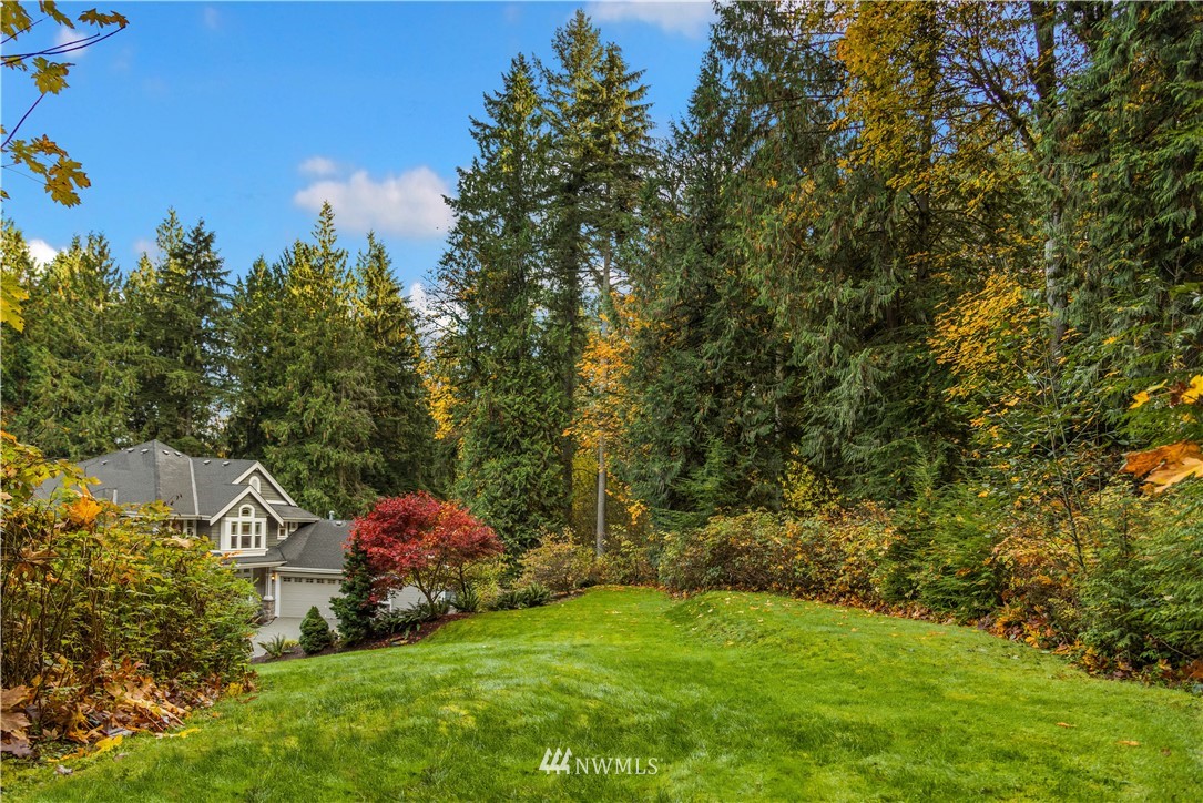 8707 West Snoqualmie Valley Road Northeast Carnation, WA 98014 - Photo 4 of 39 a view of a house with a yard