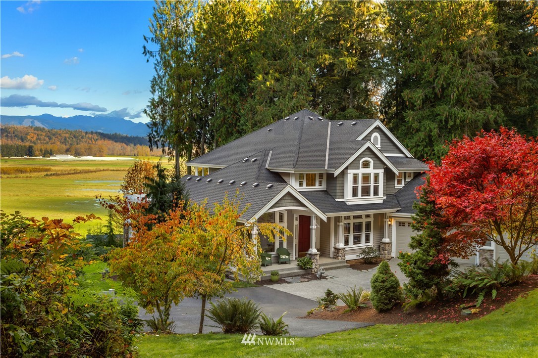 8707 West Snoqualmie Valley Road Northeast Carnation, WA 98014 - Photo 5 of 39 a aerial view of a house