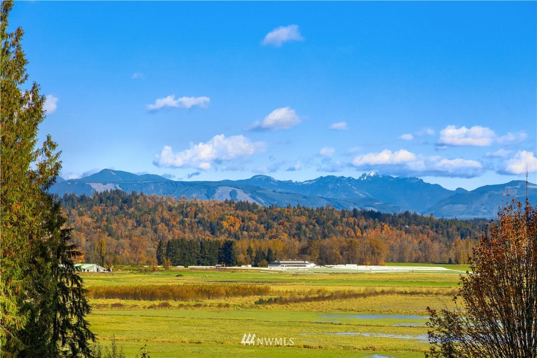 8707 West Snoqualmie Valley Road Northeast Carnation, WA 98014 - Photo 7 of 39 a view of a lake with sunset
