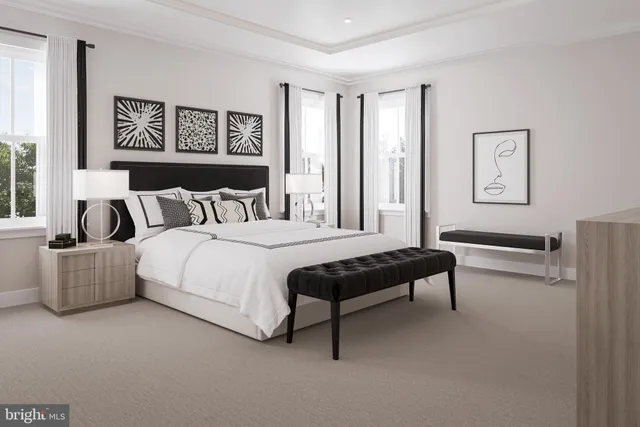 a bedroom with furniture and a large window